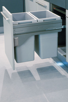 Two 38-liter bins inside a cabinet, showcasing a double waste bin sorter system, promoting efficient kitchen organization and waste separation.