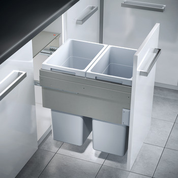 Pull-out kitchen waste bin system integrated into modern cabinetry