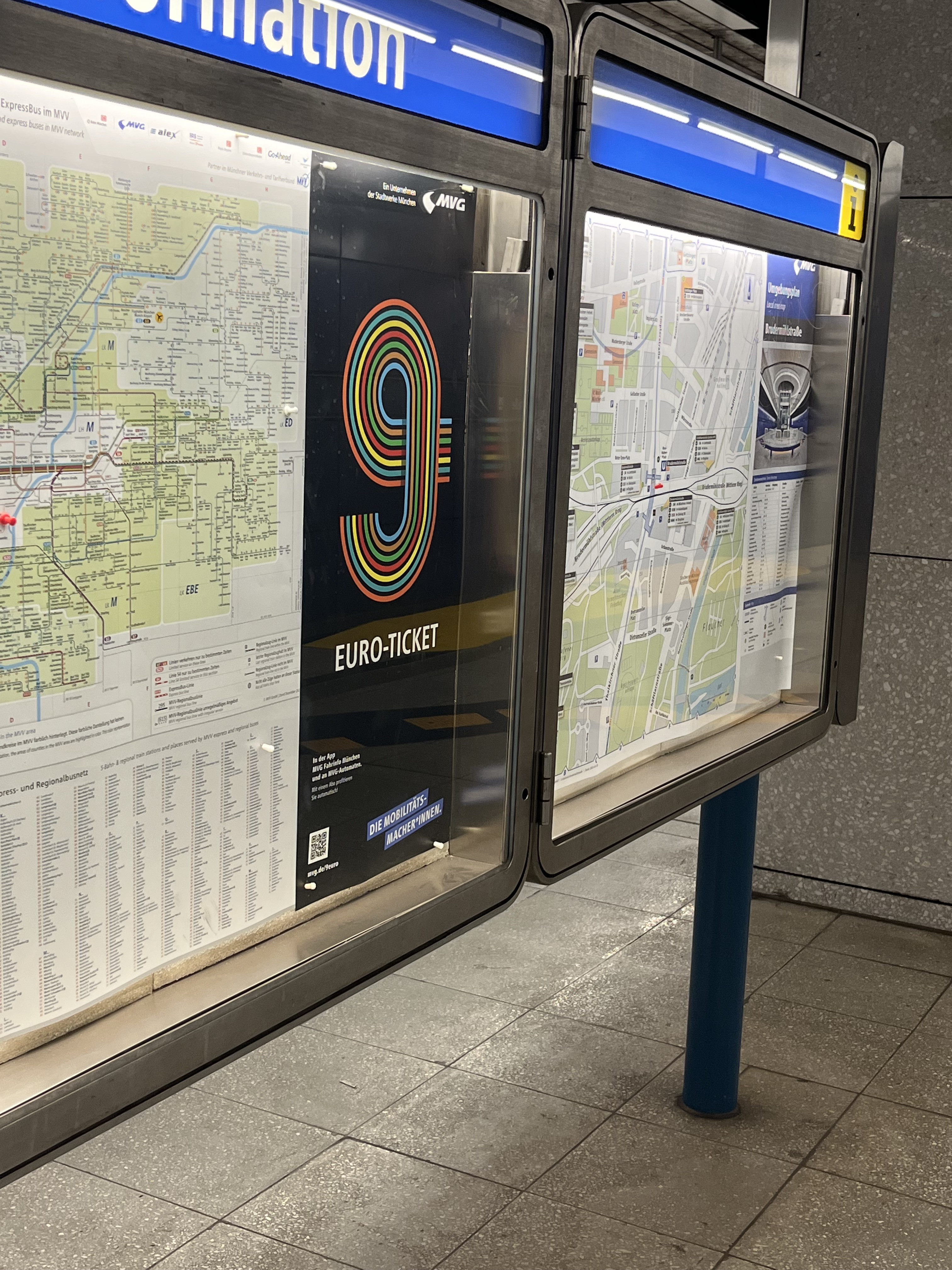 A 9 Euro Ticket advertisement at Brudermühlstraße U-Bahn station in Munich, Germany, showcasing affordable public transport options during the promotional period.