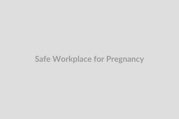Pregnant worker in an office setting, highlighting workplace safety and health