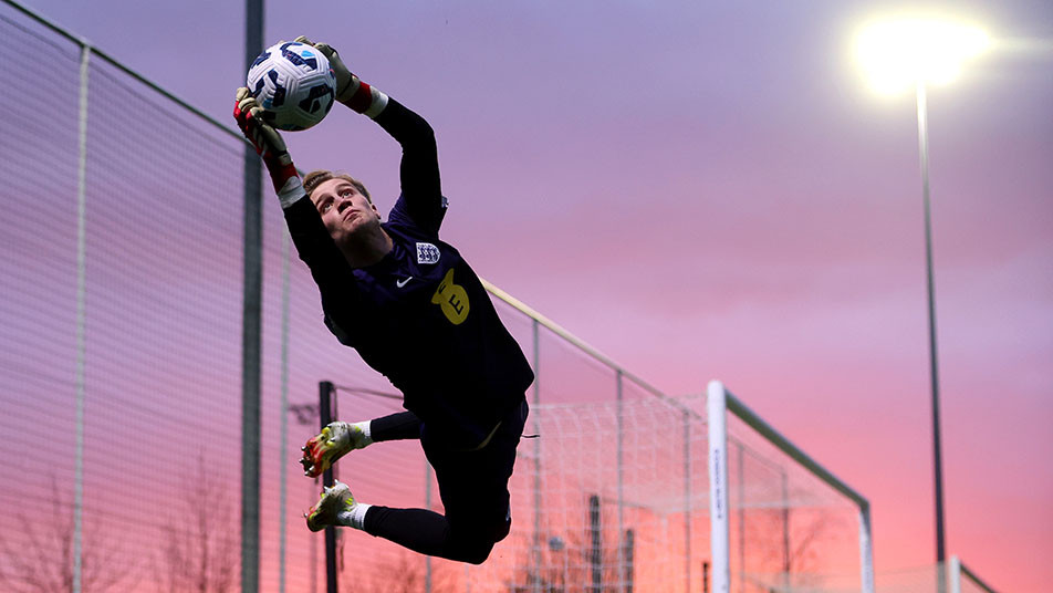 England MU17s goalkeeper Jack Porter makes an acrobatic catch in training